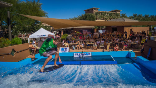 FlowTour Contestant doing a trick on FlowRider surf machine in front of a crowd