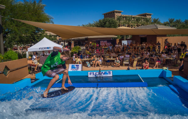 FlowTour Contestant doing a trick on FlowRider surf machine in front of a crowd
