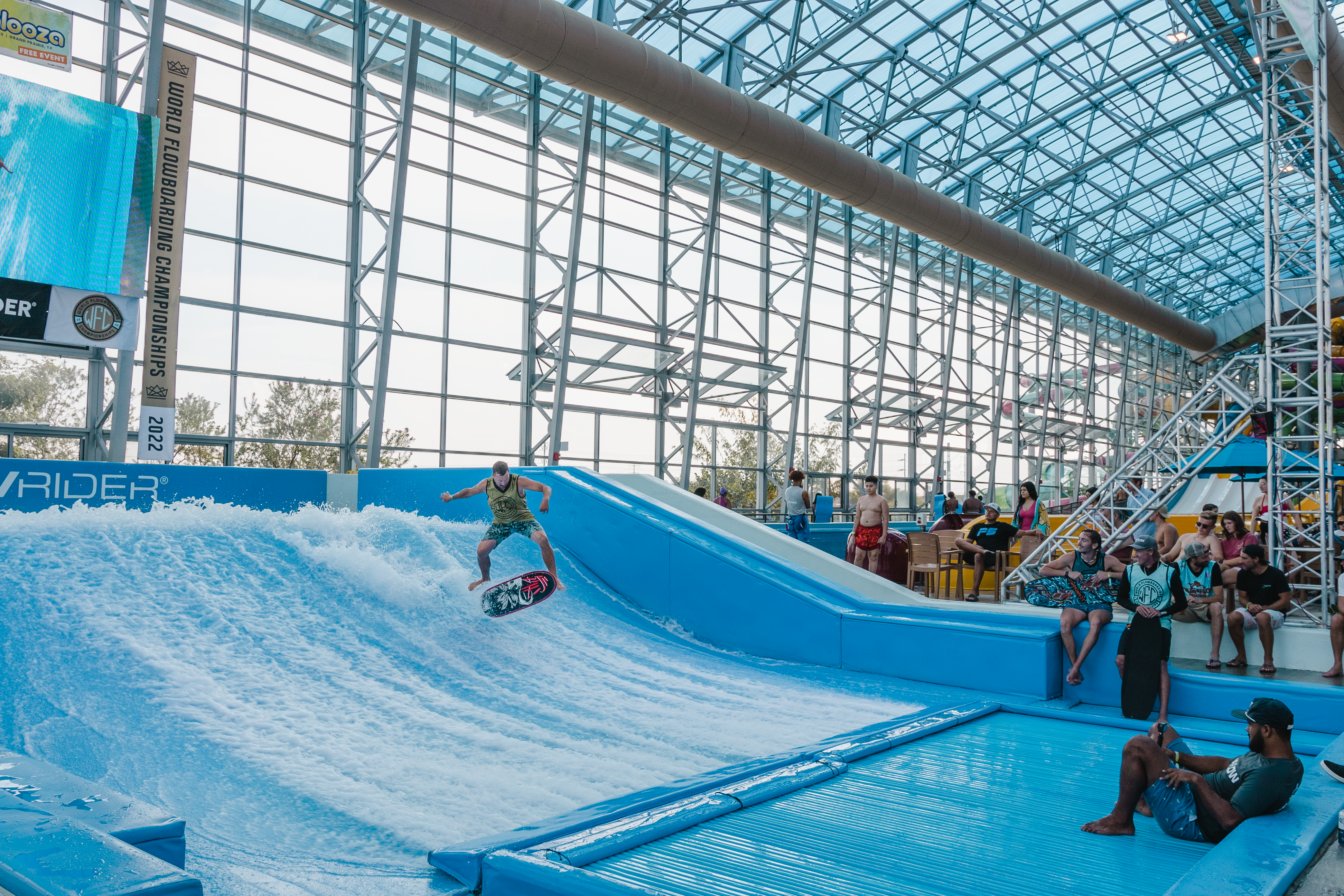 Person doing trick on flowrider surf machine