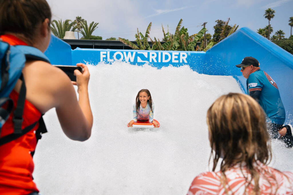Young girl riding on FlowRider